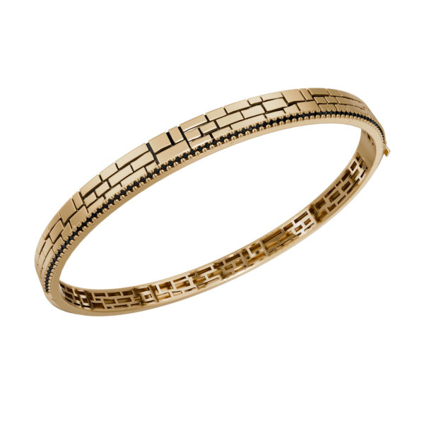 18k yellow gold rigid bracelet with geometric stone-wall texture and black diamonds