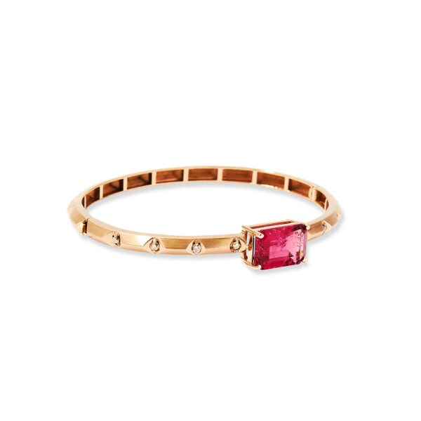 Rigid 18k rose gold bangle with a rectangular pink rubellite center and small brown diamonds, flat lay on white background