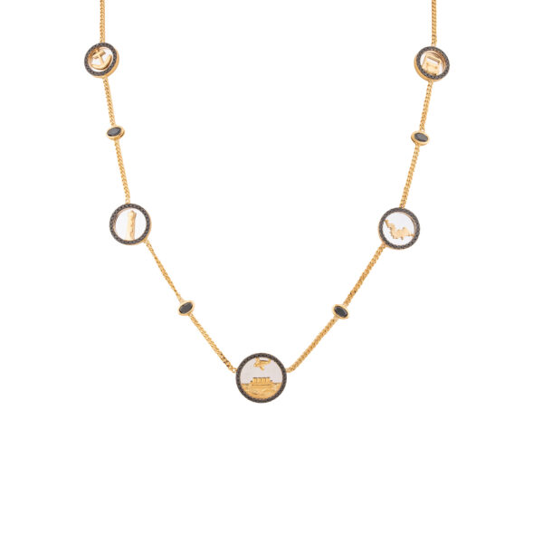 Coin station necklace in 18k yellow gold with black diamonds on a fine chain, flat lay on white background
